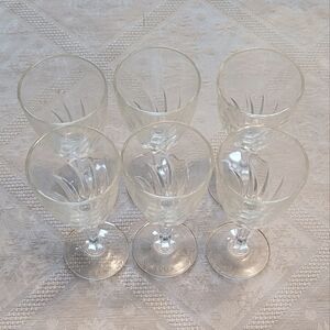 A set of six glass sherry glasses.